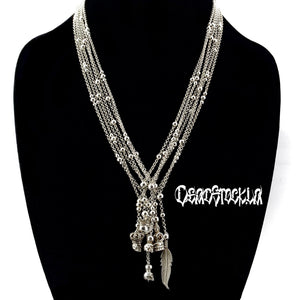 Several Silver necklaces on a black bust